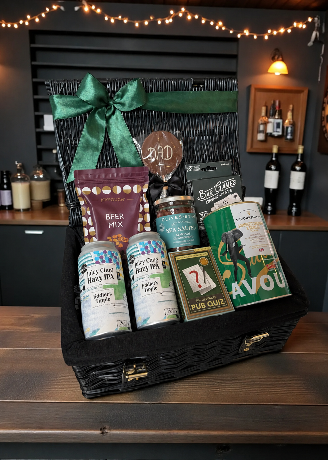 Gift basket with beer-themed items on a wooden surface.