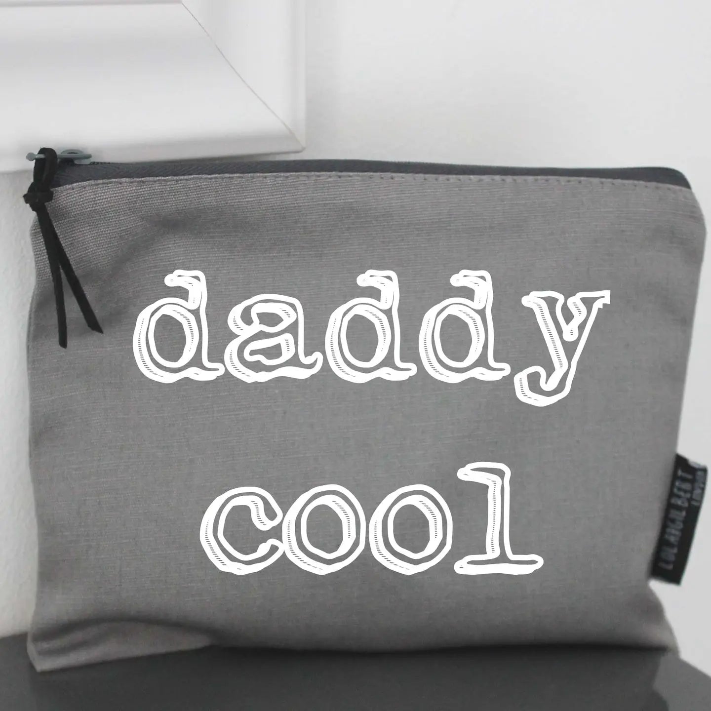 Grey "Daddy Cool" canvas zippered washbag pouch with contrasting zip and suede pull.