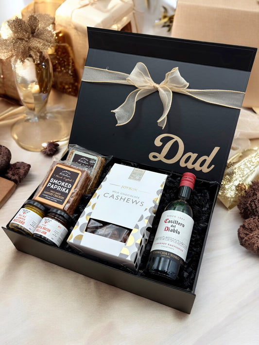 dad gift box with fine wine, crackers, chutneys, and chocolate cashews.