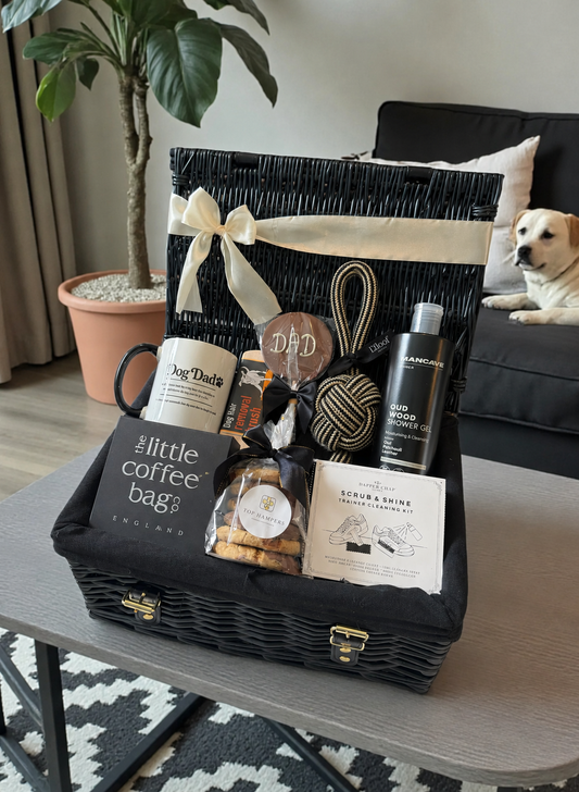 Gift basket with various items on a coffee table in a living room setting.