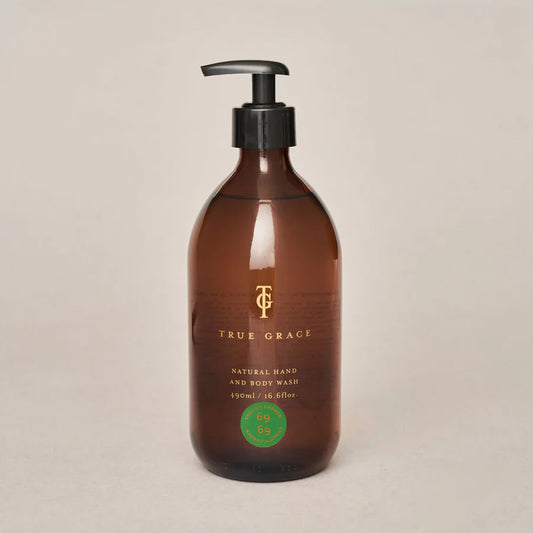 True Grace English Garden hand and body wash in amber glass bottle.