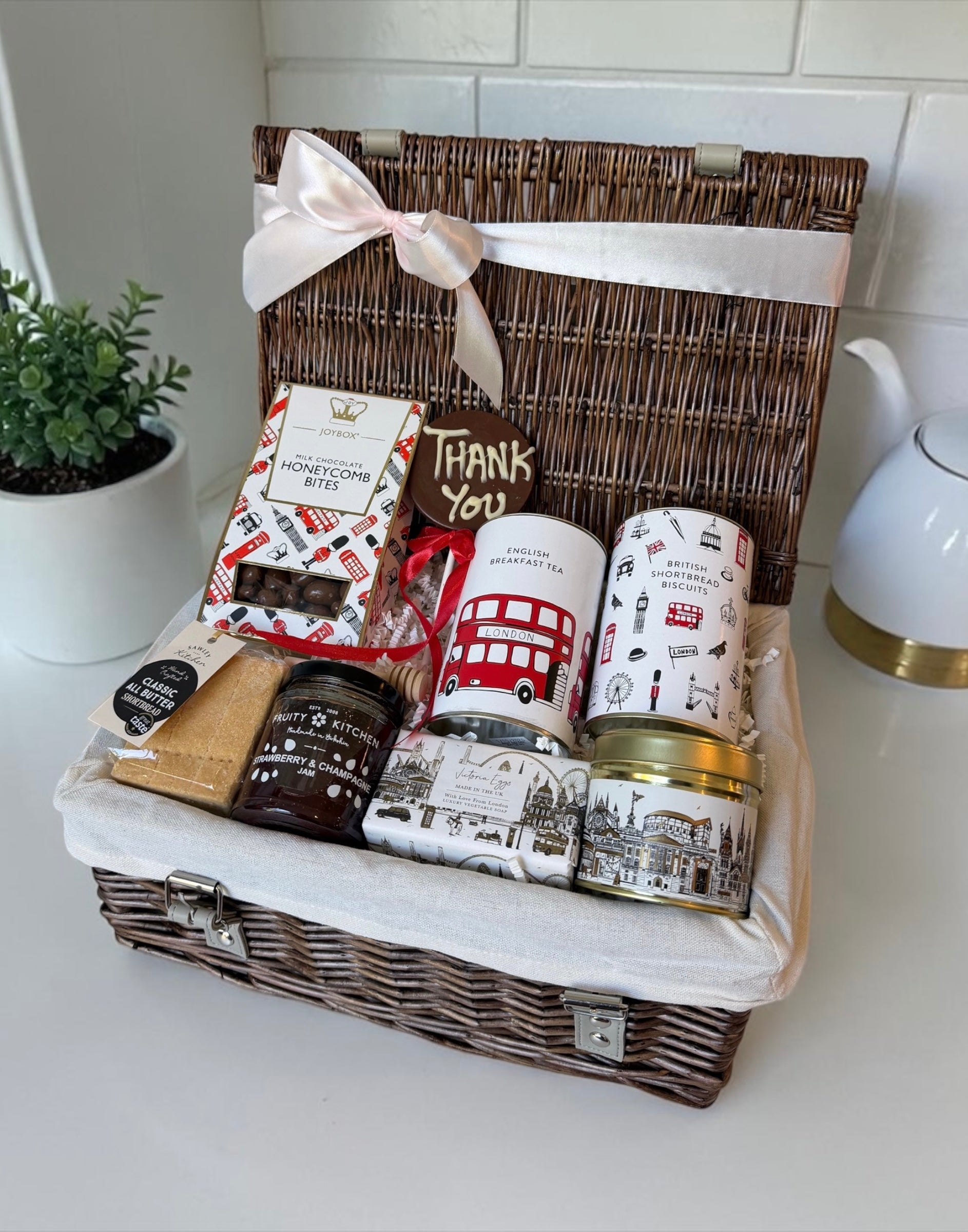gift hamper thank you appreciation with english treats including chocolate, breakfast tea, jam, shortbread, a candle and hand soap