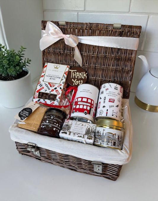 gift hamper thank you appreciation with english treats including chocolate, breakfast tea, jam, shortbread, a candle and hand soap