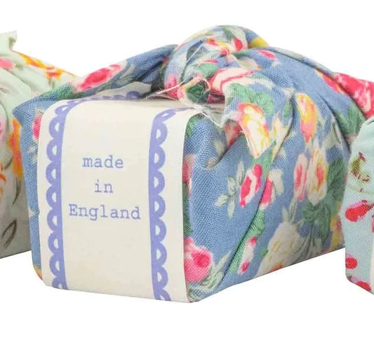 Blue floral fabric wrapped soap made in England.