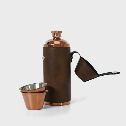 Brown faux leather flask with copper shot cups, luxury portable gift.
