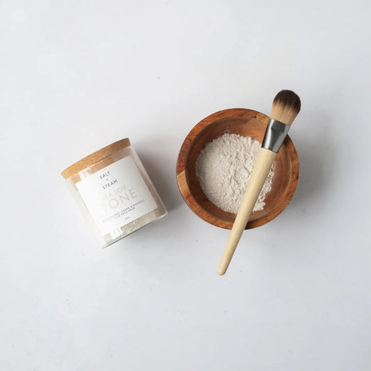 Frankincense and Cedarwood clay face mask with mixing bowl and brush.