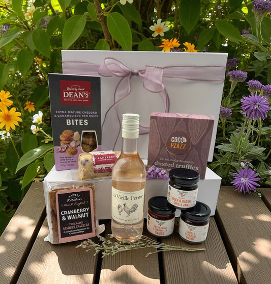 Girly Wine & Treats Gift Set featuring La Vieille Ferme wine, cranberry & walnut crackers, cranberry cheese barrel, miniature preserves, and dusted truffles.