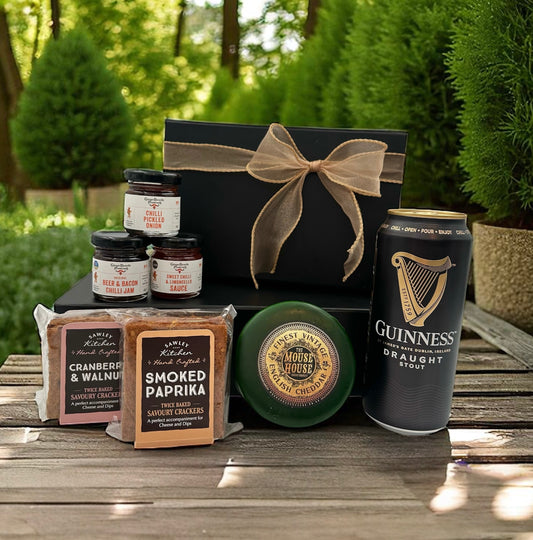 Guinness and Cheese Gift Set with can of Guinness, vintage cheddar, smoked paprika and cranberry & walnut crackers, plus three miniature preserves.