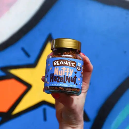 Nutty Hazelnut Instant Coffee jar with vibrant label design featuring roasted hazelnut flavor.