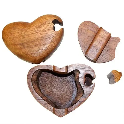 Heart shaped wooden Bali magic box puzzle with hidden compartment.