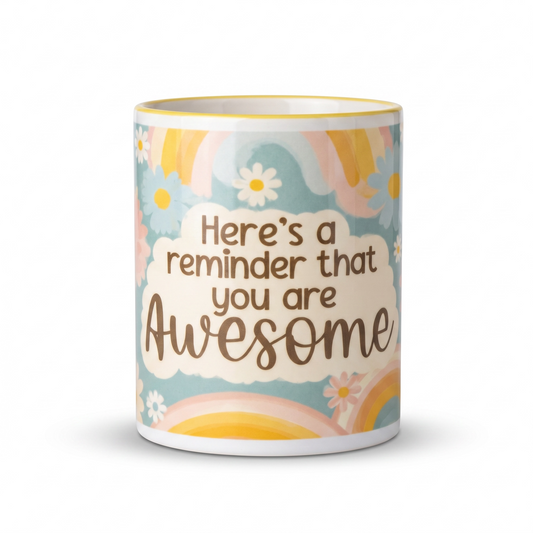 A white ceramic mug with a colorful retro design featuring rainbows, daisies, and a cream cloud with the text 'Here's a reminder that you are Awesome'.