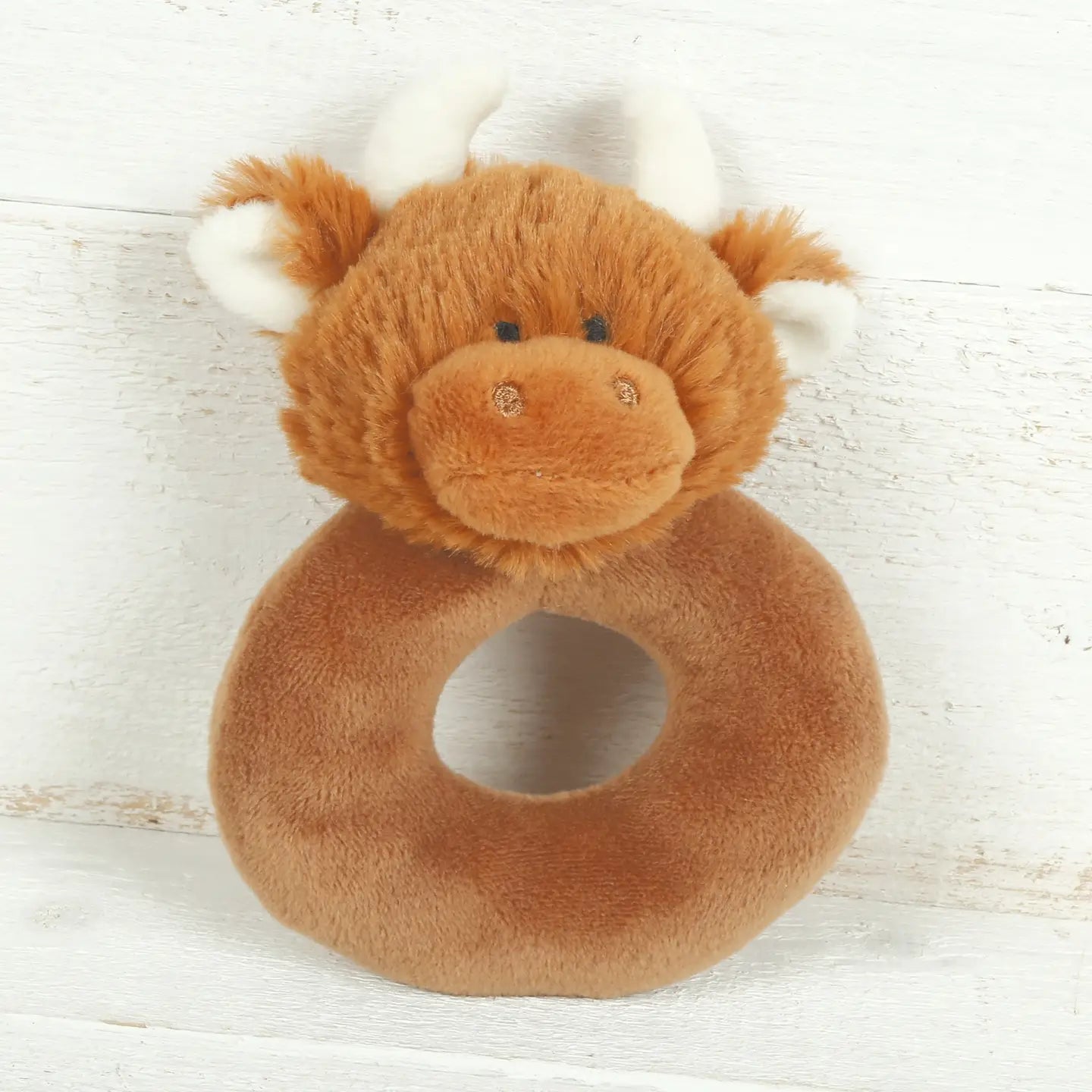 Handmade baby rattle with a soft sound, designed for tiny hands and suitable as a keepsake gift.