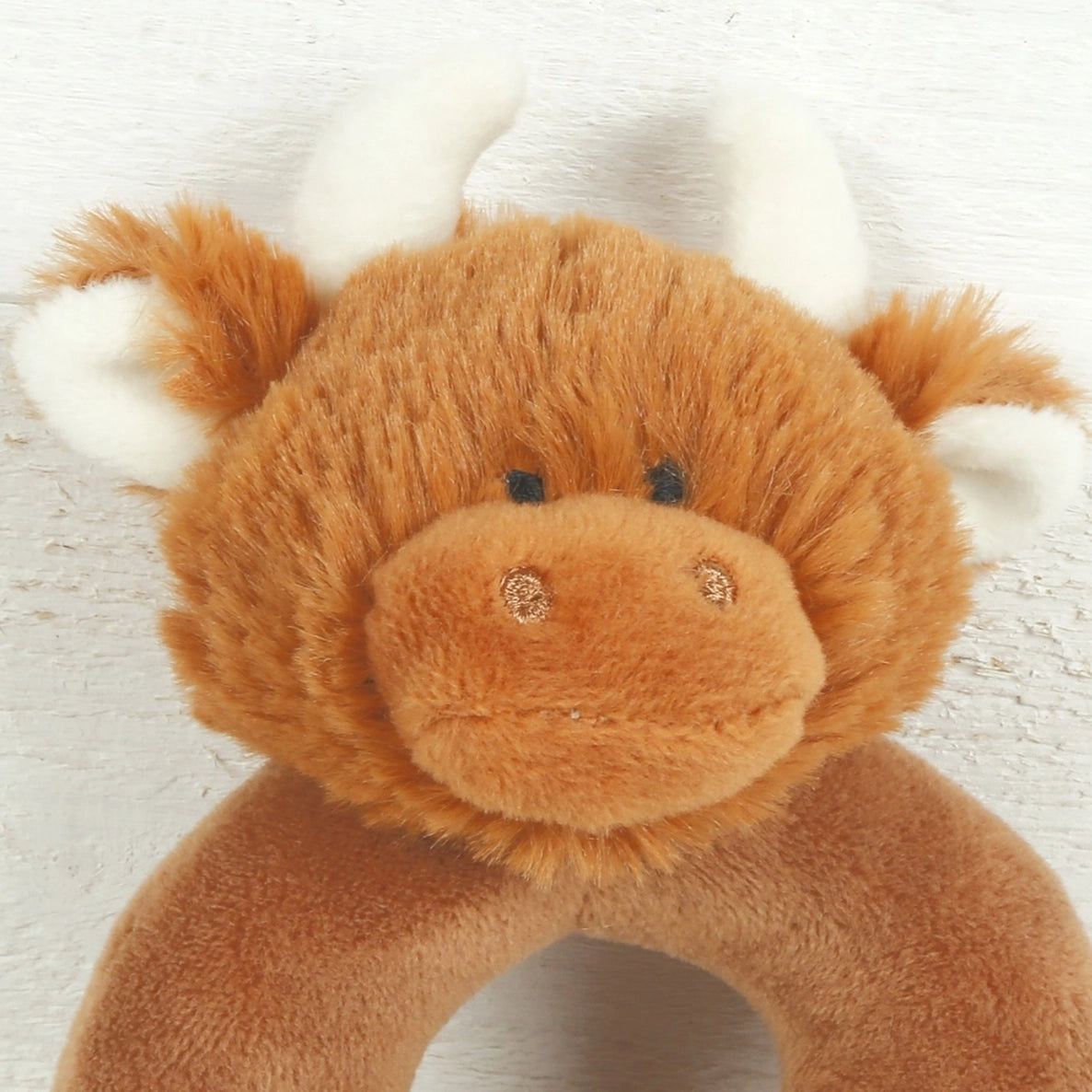 Handmade baby rattle with a soft sound, designed for tiny hands and suitable as a keepsake gift.