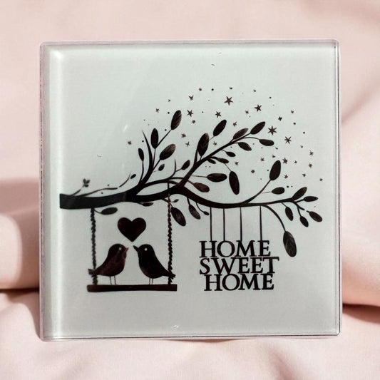10cm glass coaster with “Home Sweet Home” and birds on a tree design – charming home décor or gift idea.