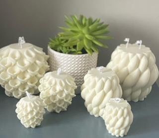 Large Olga candle, handmade and scented, with decorative design.