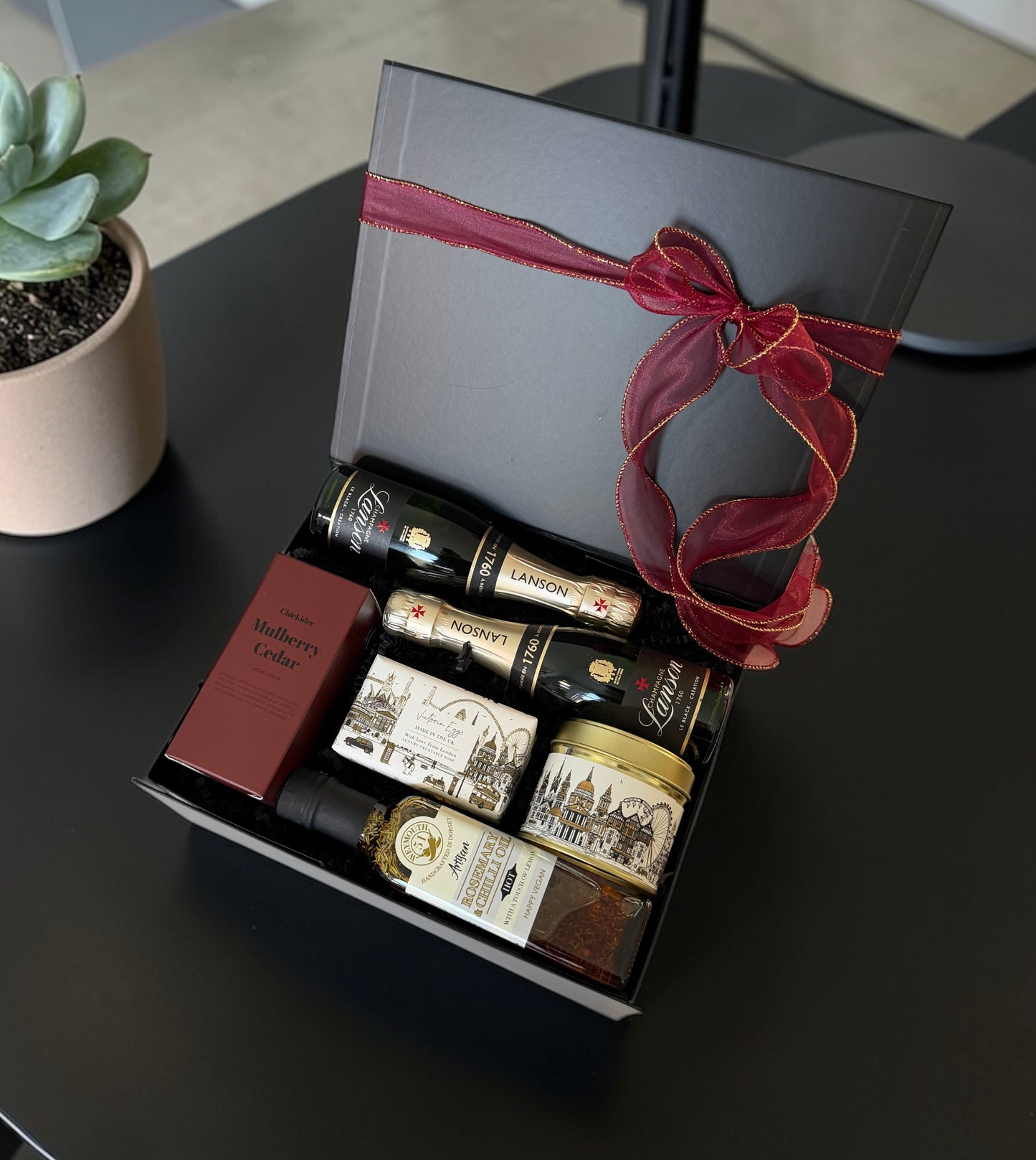 Corporate gift hamper with Champagne or Birra Moretti, candle, home spray, infused oil and luxury soap.