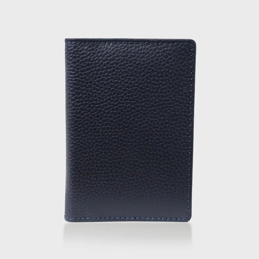 Pebble Grain Leather Passport Holder in Navy, stylish travel accessory.