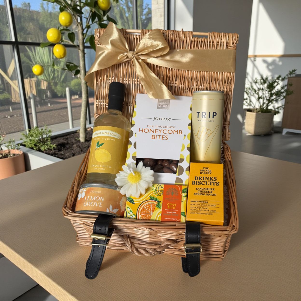 Lemon Grove gift hamper with Limoncello, honeycomb chocolate bites, cheese biscuits, lemon candle, citrus soap and Trip drink.