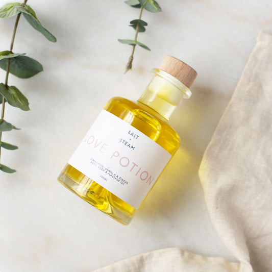 Love potion body, bath and massage oil in glass bottle 