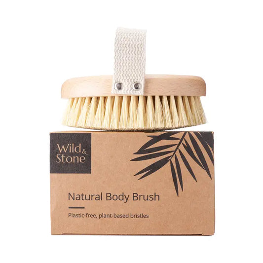 Natural Beechwood exfoliating body brush with sisal bristles and cotton strap for skincare.