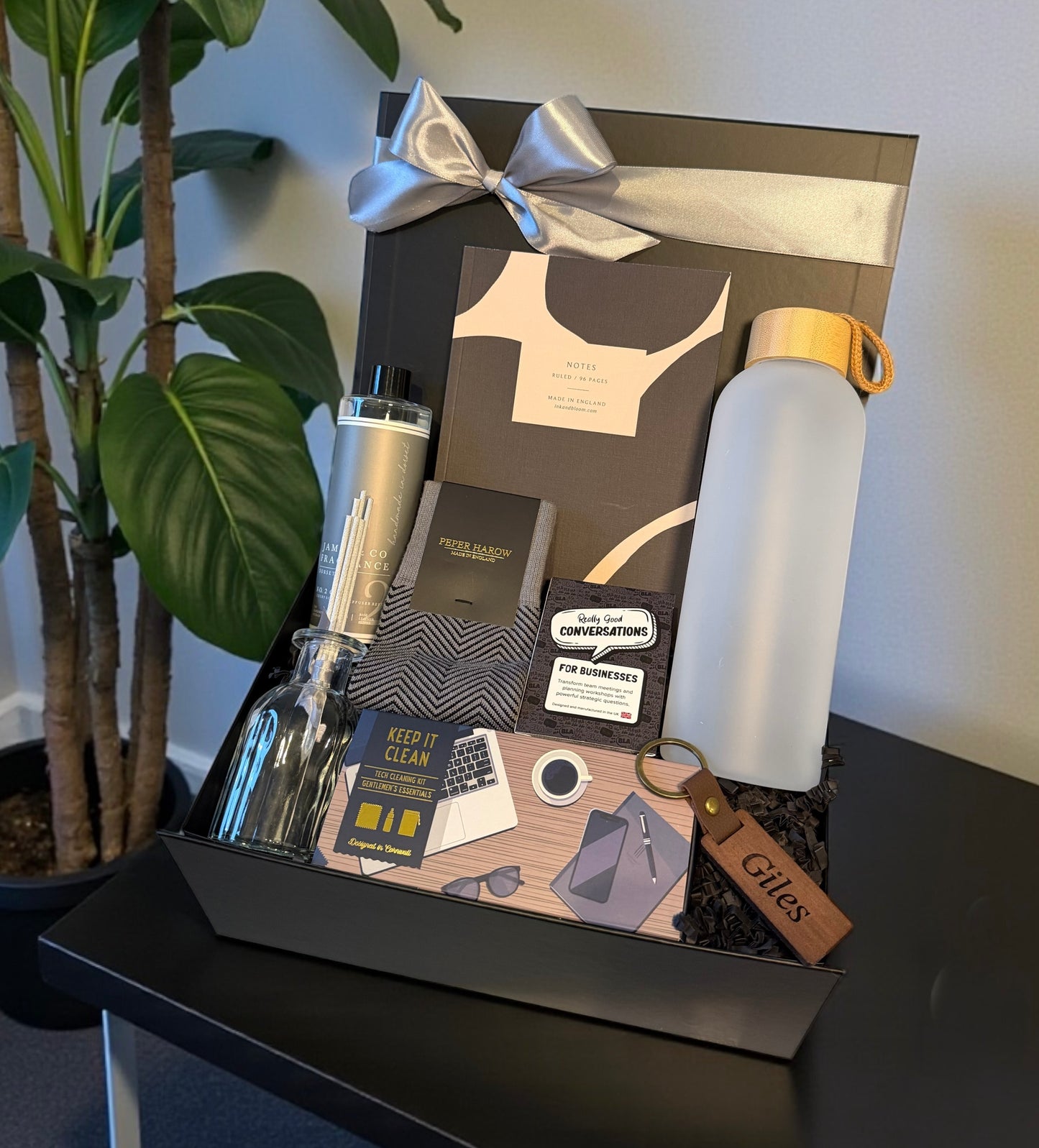 office corporate gift box with water bottle, socks, tech care kit and other items