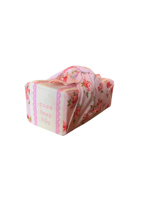 Pink floral fabric wrapped soap.