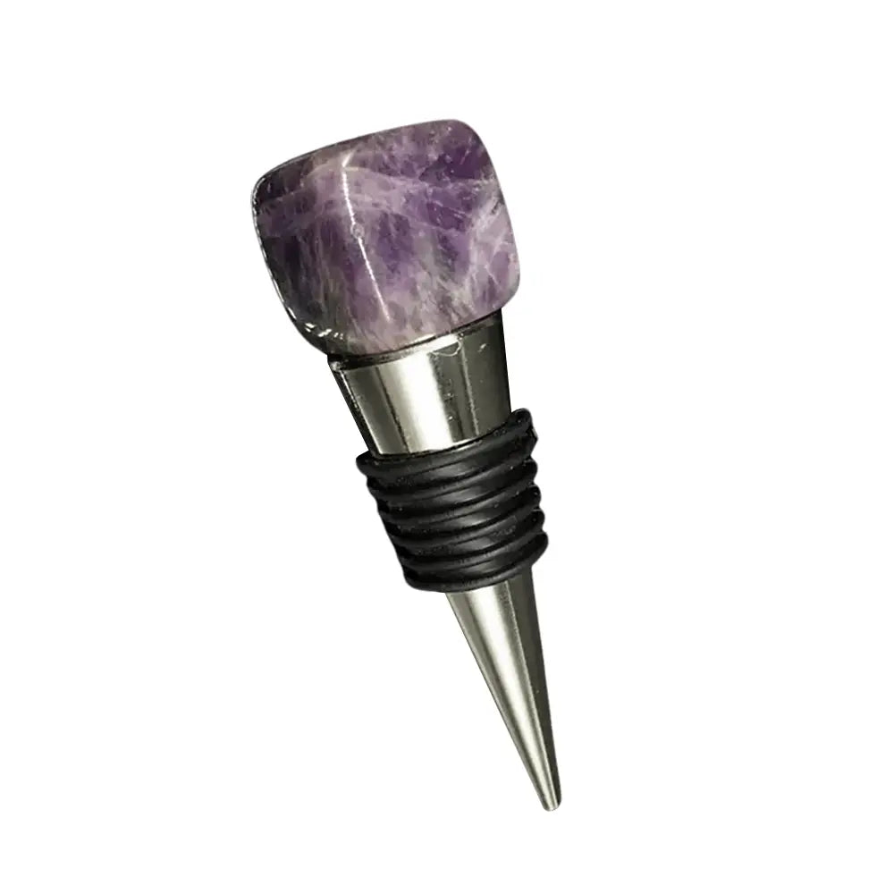 Amethyst bottle stopper with metal base and gemstone top.