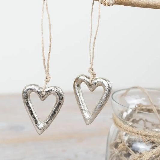Raw silver heart ornament hung on jute twine, 12cm.