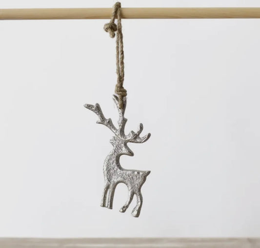 Silver reindeer ornament hanging on a white background. christmas decoration or gift