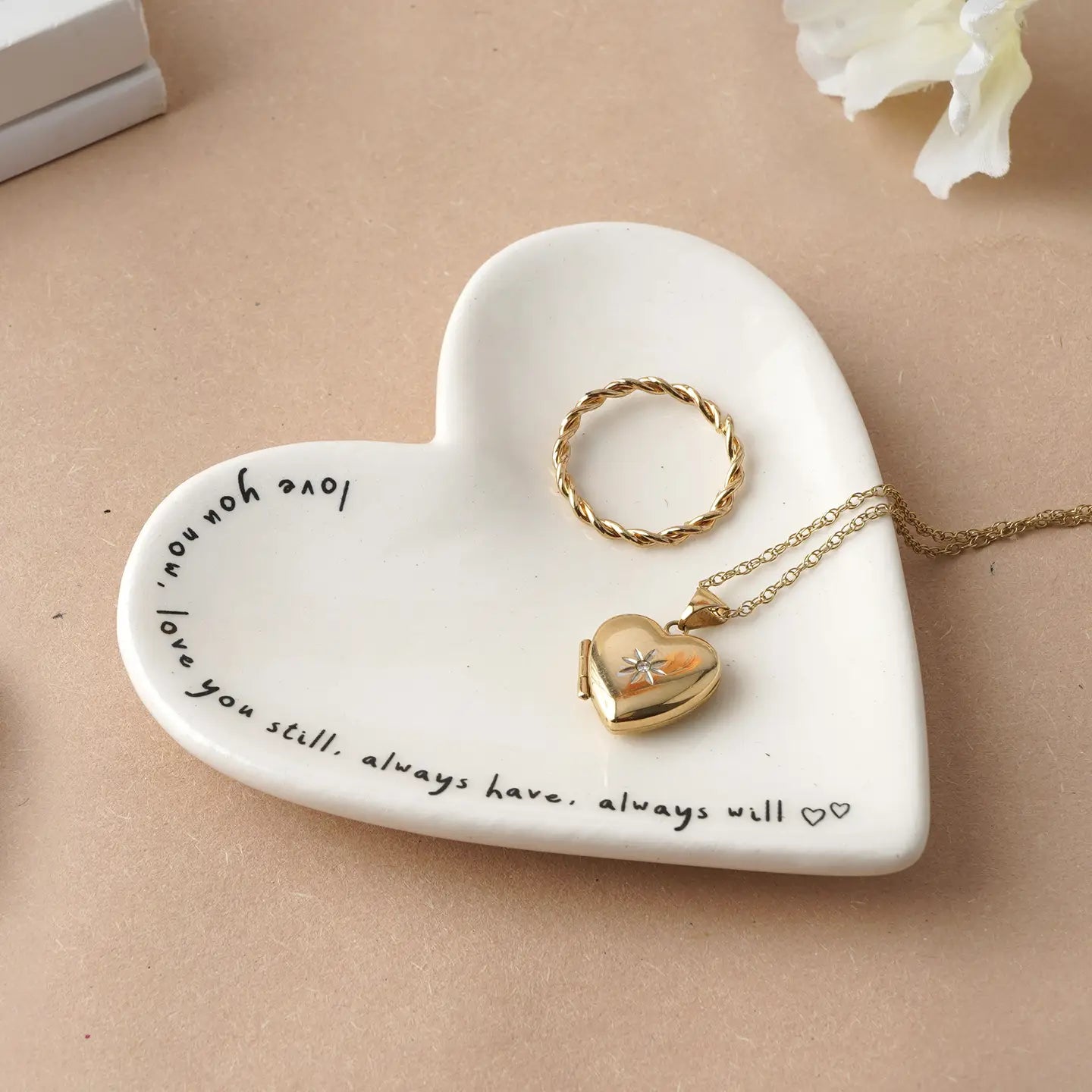 Ceramic heart-shaped ring dish with the message “Love you now, love you still, always have, always will” in a gift box.