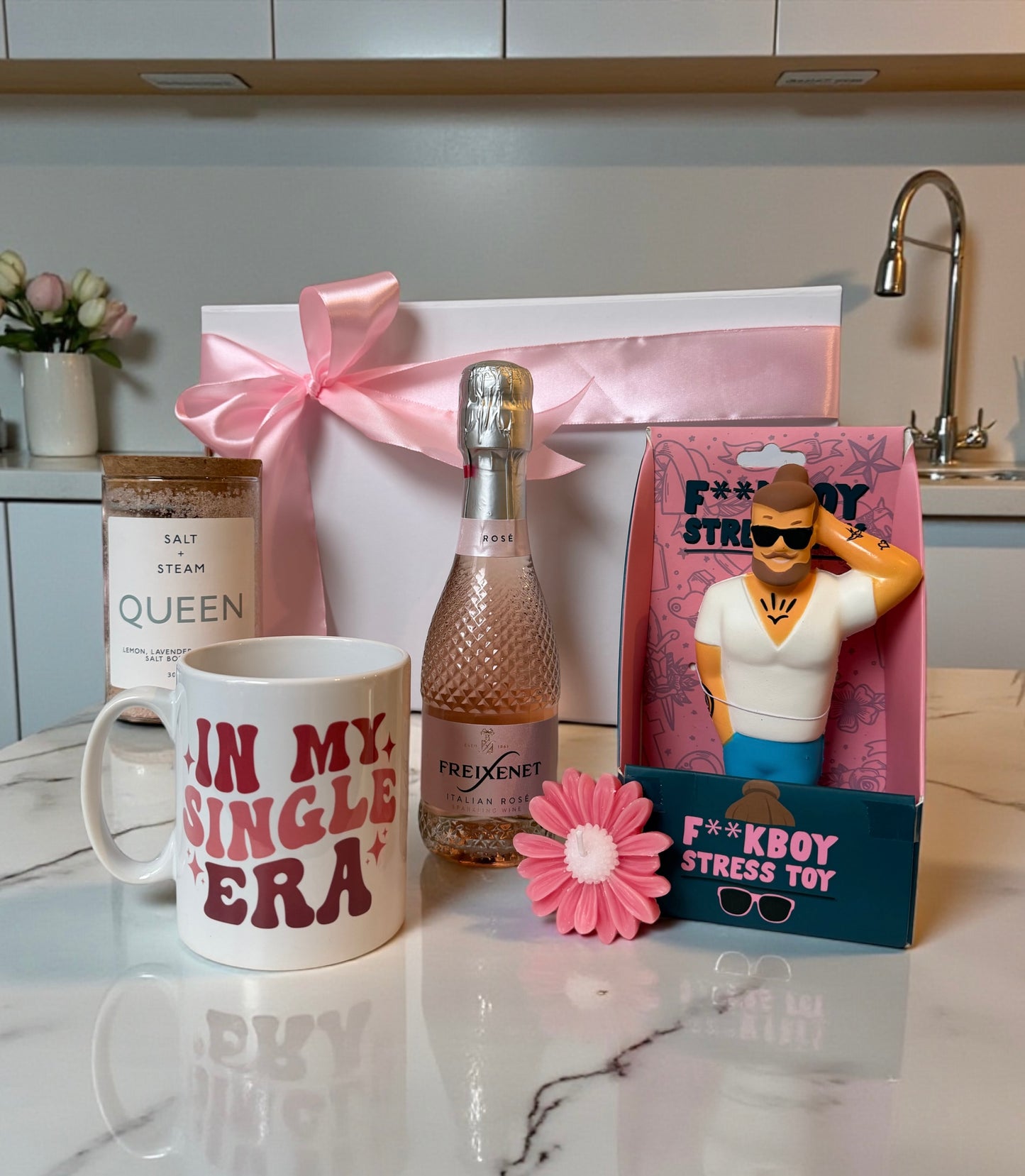 gift set for breakup with single era mug, mini rose prosecco, queen body scrub, candle and stress toy