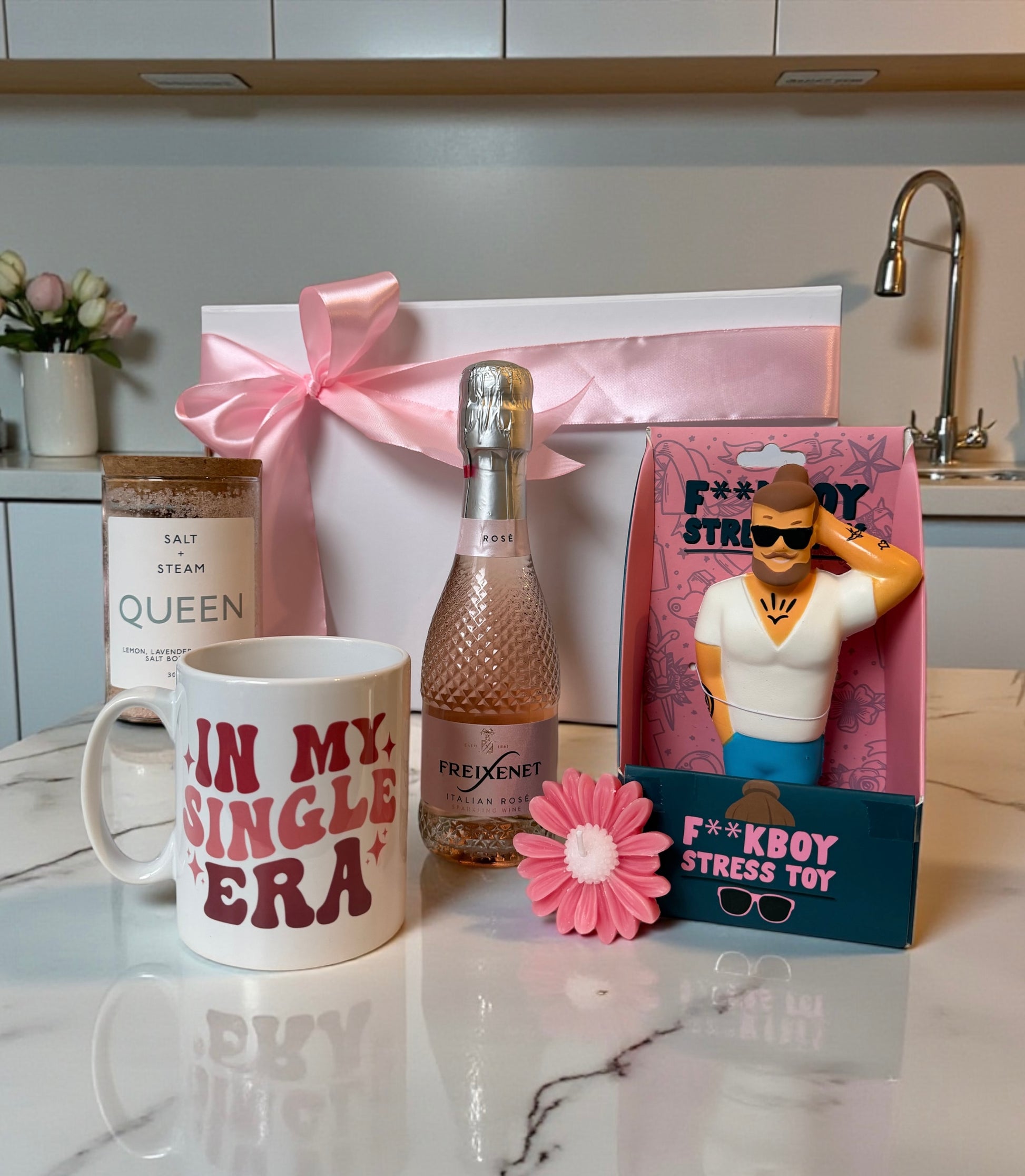 gift set for breakup with single era mug, mini rose prosecco, queen body scrub, candle and stress toy