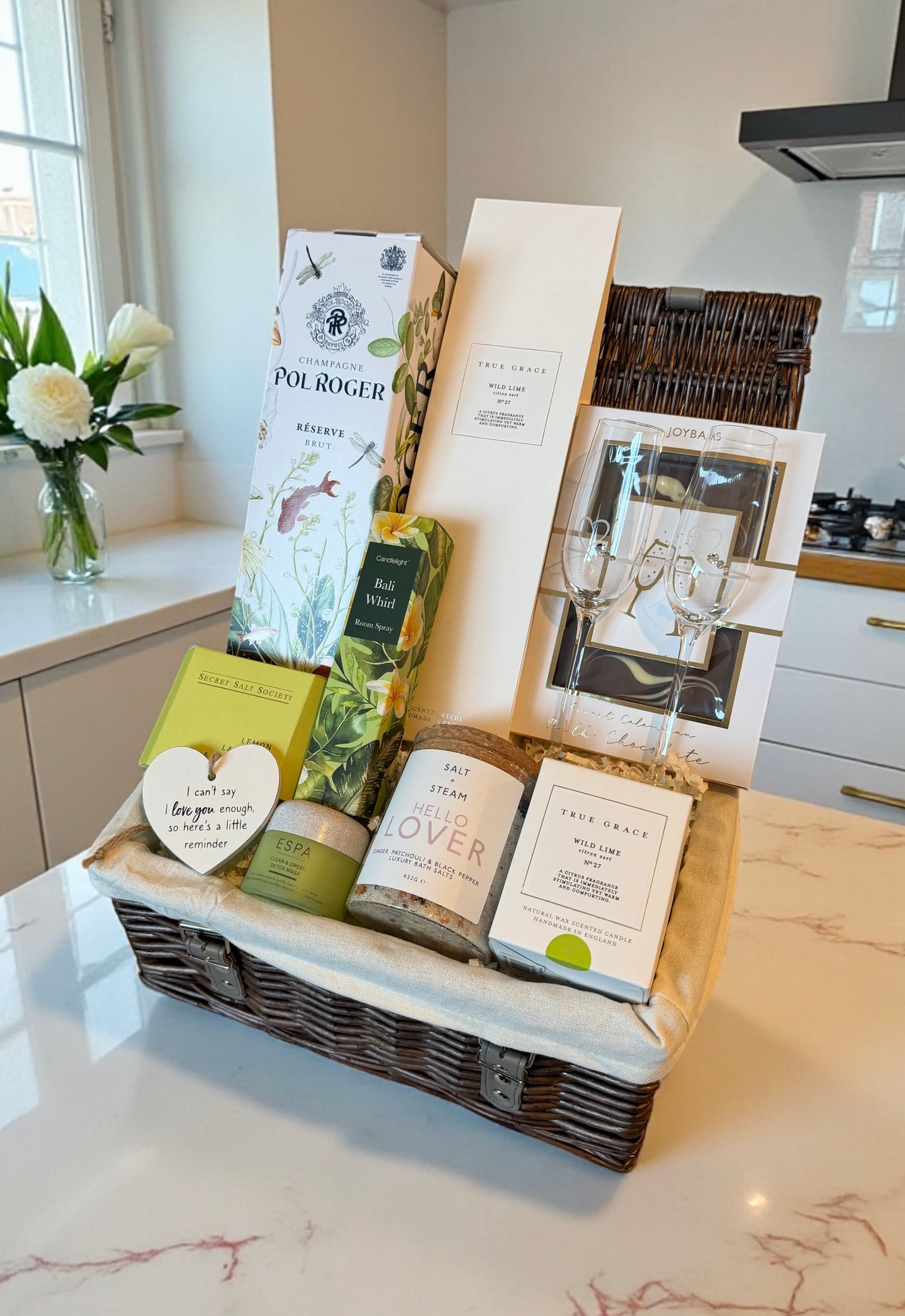 love and romance gift hamper with champagne, flutes, chocolate and pampering items