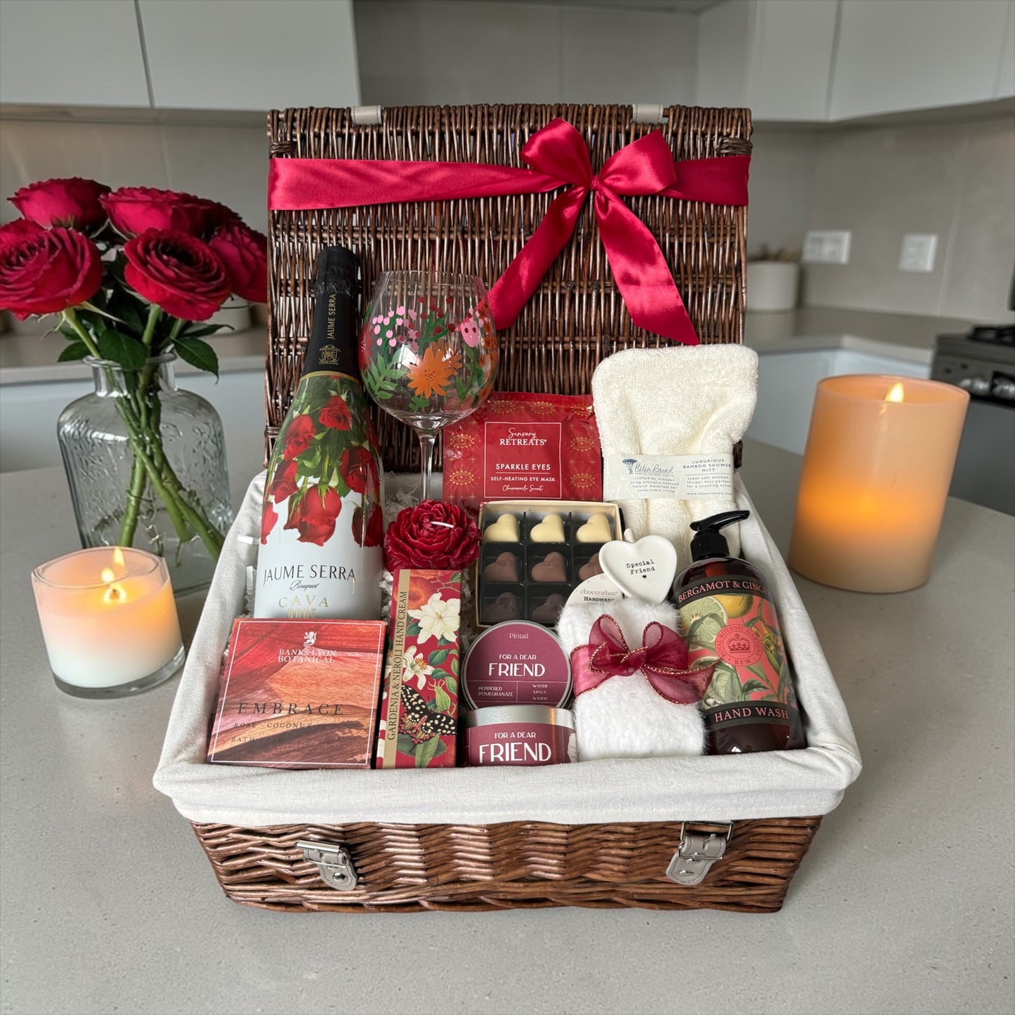 Special friend gift hamper with wildflower glass, bath salts, candle, fluffy socks, chocolates and choice of gin, wine or cava.