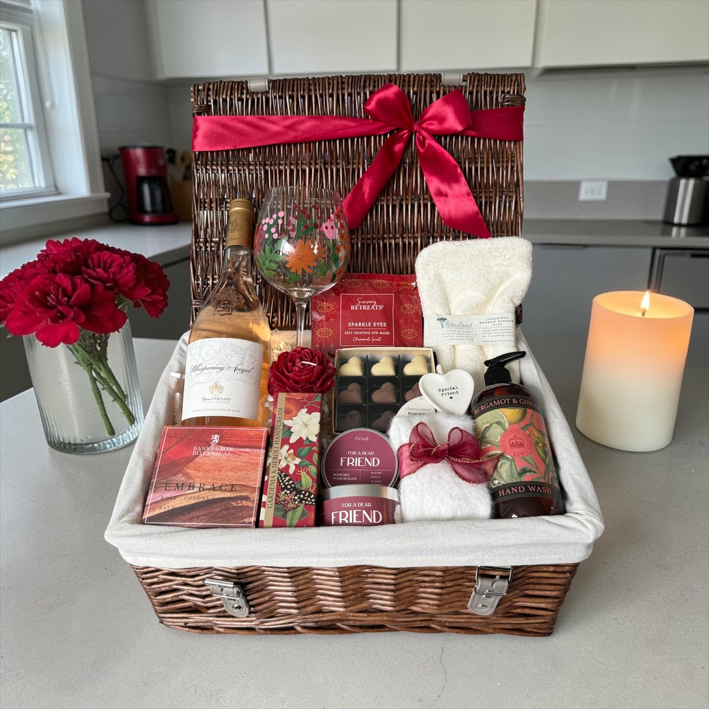 Special friend gift hamper with wildflower glass, bath salts, candle, fluffy socks, chocolates and choice of gin, wine or cava.