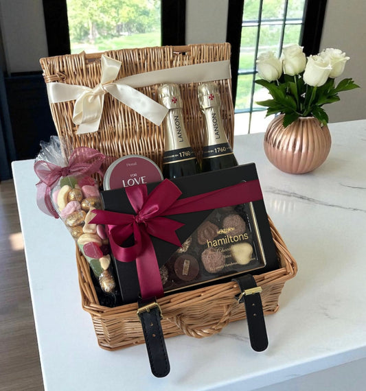 Luxury gift with champagne, chocolates and sweets