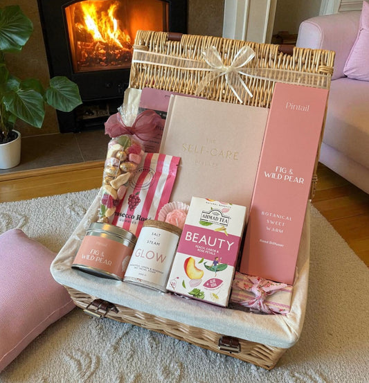 Sweet Pampering Hamper with candle, reed diffuser, bath soak, tea, sweets, gummies, planner, and chocolate – luxury self-care gift.