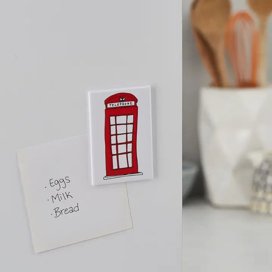 Hand illustrated red telephone box fridge magnet symbolizing British culture.