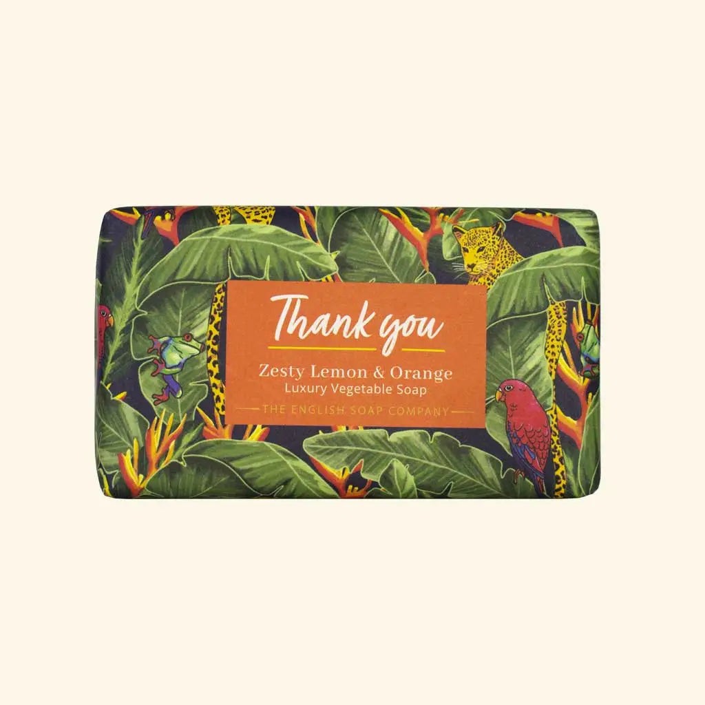Soap bar with a colorful leaf pattern and 'Thank you' label on a beige background