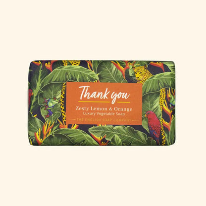 Soap bar with a colorful leaf pattern and 'Thank you' label on a beige background
