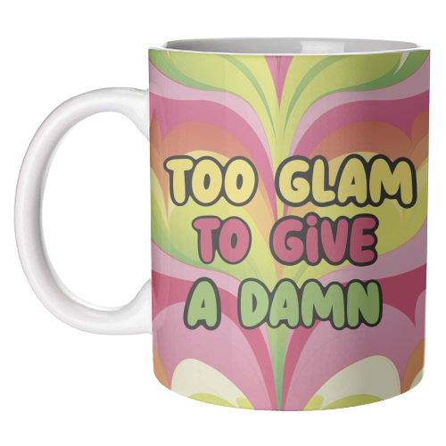 Mug with "Too Glam To Give a Damn" text and colorful background.