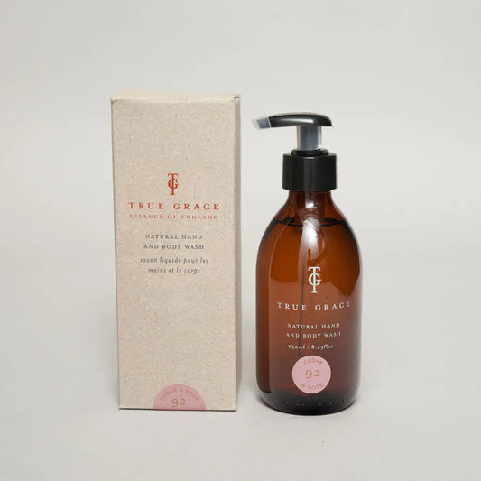 True Grace Cedar & Rose Hand and Body Wash 240ml in amber glass with pump dispenser.