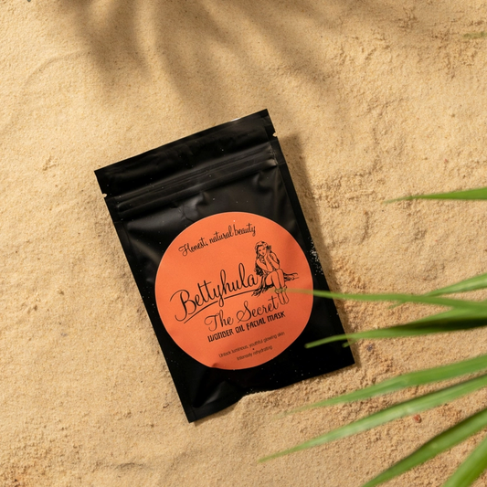 Rehydrating Facial Mask with Secret Wonder Oil on sandy background.