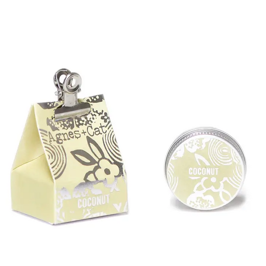 Coconut Lip Balm with shea, mango, and avocado butters in stylish packaging.