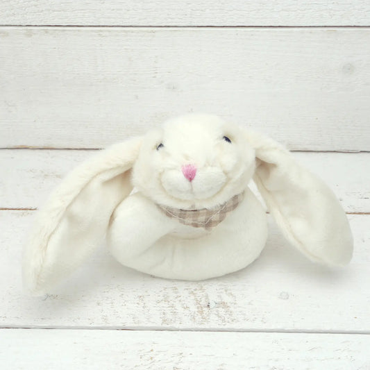 Cream-colored baby bunny toy rattle with long ears.