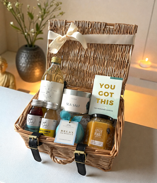 Gift basket with various items including a bottle of olive oil, a jar of salt, and a card that says 'You Got This'.